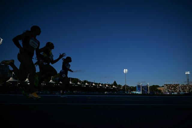 Athletes compete in the women's 200m semi-final 2 during the athletics event at the Scotstoun Stadium in Glasgow, on day seven of the Commonwealth Games in Glasgow, Scotland, on July 30, 2026. (Photo by ANDY BUCHANAN / AFP)