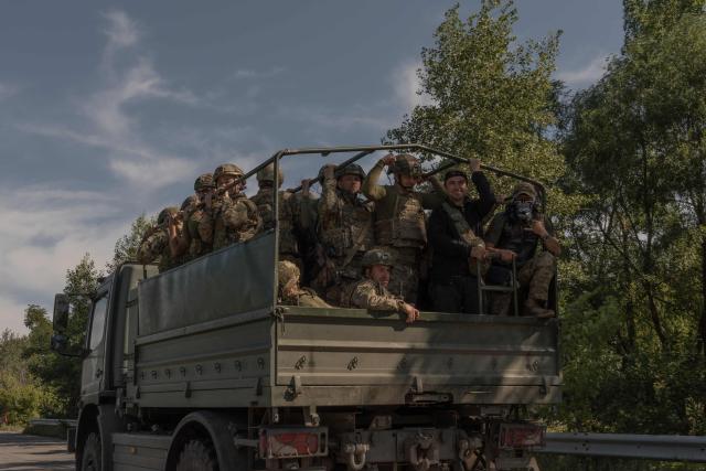 Ukrainian soldiers drive in a military truck along a road in the Kharkiv region on July 30, 2026, amid the Russian invasion of Ukraine. (Photo by Roman PILIPEY / AFP)