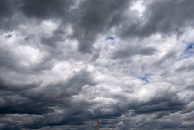 The Washington Monument is seen as stratocumulus clouds stretch across the sky above the National Mall in Washington, DC on July 30, 2026.  (Photo by Kent Nishimura / AFP)