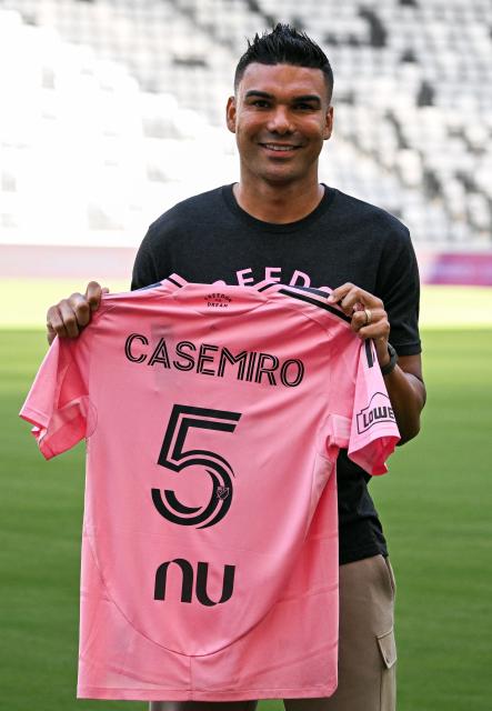 Brazilian midfielder Casemiro poses with his jersey as he's officially introduced as Inter Miami's new signing during an event at NU Stadium in Miami, Florida, on July 30, 2026. Casemiro, who has 91 caps for Brazil and won five Champions League titles with Spain's Real Madrid, was a free agent after Manchester United opted not to renew his contract following a mixed four-year stint at the Premier League giants. (Photo by CHANDAN KHANNA / AFP)