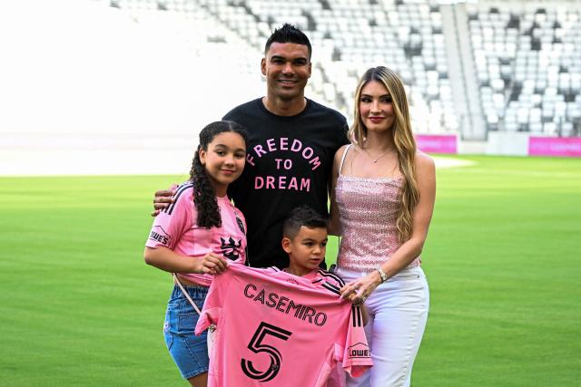 Brazilian midfielder Casemiro poses with his wife Anna Mariana and children Sara (L) and Caio as he's officially introduced as Inter Miami's new signing during an event at NU Stadium in Miami, Florida, on July 30, 2026. Casemiro, who has 91 caps for Brazil and won five Champions League titles with Spain's Real Madrid, was a free agent after Manchester United opted not to renew his contract following a mixed four-year stint at the Premier League giants. (Photo by CHANDAN KHANNA / AFP)