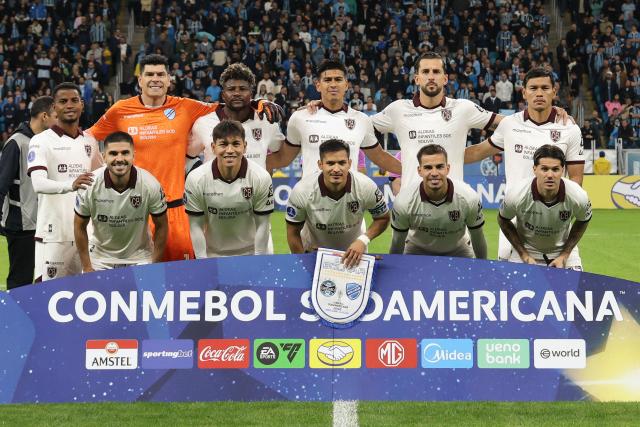 Bolivar's players pose for a team photo ahead of the second leg of the Copa Sudamericana knockout round play-off football match between Brazil's Gremio and Bolivia's Bolivar at the Arena do Gremio stadium in Porto Alegre, state of Rio Grande do Sul, Brazil, on July 30, 2026. (Photo by SILVIO AVILA / AFP)