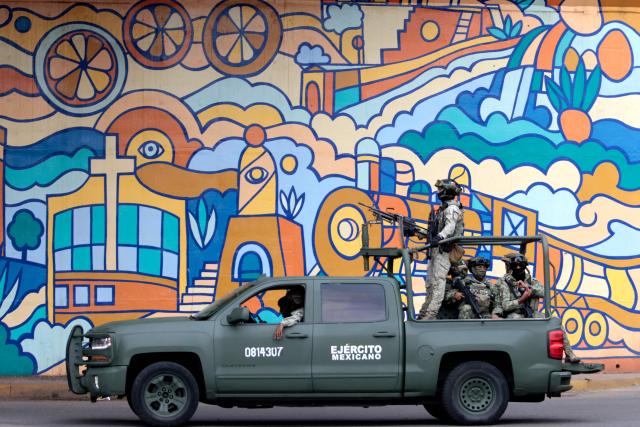 Mexican Army personnel secure the area where the Jalisco New Generation Cartel (CJNG) leader known as "R1" was captured in Atotonilco, Jalisco state, Mexico, on July 30, 2026. Mexico said on July 30 it had captured the alleged mastermind behind the assassination of a hardline anti-crime mayor last November, a killing that sparked international outrage. (Photo by ULISES RUIZ / AFP)