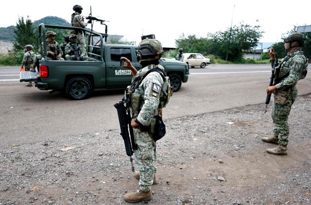 Mexican Army personnel secure the area where the Jalisco New Generation Cartel (CJNG) leader known as "R1" was captured in Atotonilco, Jalisco state, Mexico, on July 30, 2026. Mexico said on July 30 it had captured the alleged mastermind behind the assassination of a hardline anti-crime mayor last November, a killing that sparked international outrage. (Photo by ULISES RUIZ / AFP)