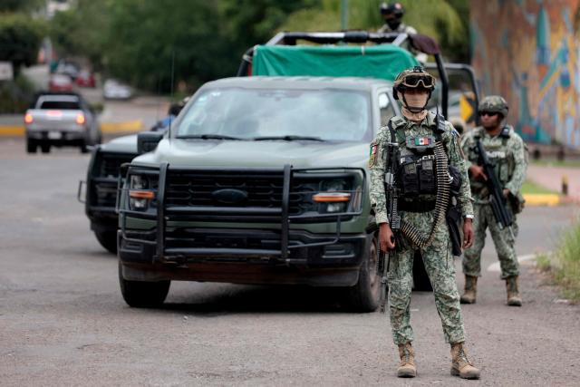 Mexican Army personnel secure the area where the Jalisco New Generation Cartel (CJNG) leader known as "R1" was captured in Atotonilco, Jalisco state, Mexico, on July 30, 2026. Mexico said on July 30 it had captured the alleged mastermind behind the assassination of a hardline anti-crime mayor last November, a killing that sparked international outrage. (Photo by ULISES RUIZ / AFP)