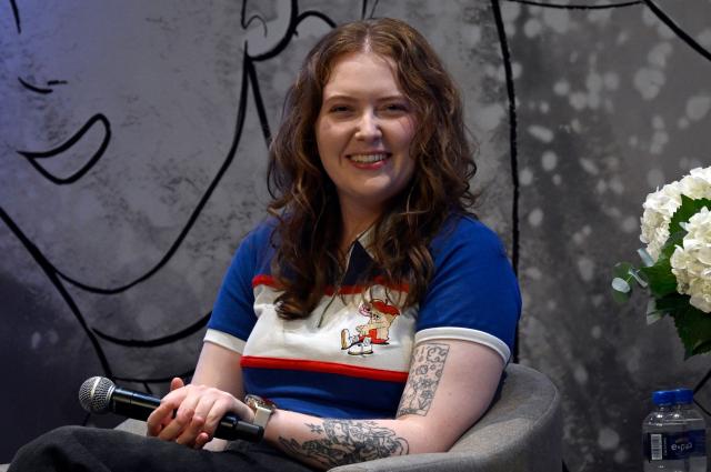 British author of Heartstopper Alice Oseman speaks during the presentation of the latest book in the Heartstopper saga at the Esperanza Iris Theater in Mexico City on July 30, 2026. The Heartstopper saga was adapted into a Netflix TV series and recently into a movie on the same platform. (Photo by Alfredo ESTRELLA / AFP)