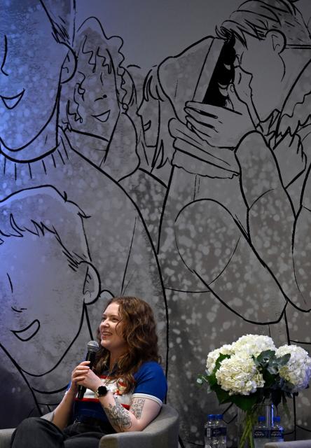 British author of Heartstopper Alice Oseman speaks during the presentation of the latest book in the Heartstopper saga at the Esperanza Iris Theater in Mexico City on July 30, 2026. The Heartstopper saga was adapted into a Netflix TV series and recently into a movie on the same platform. (Photo by Alfredo ESTRELLA / AFP)