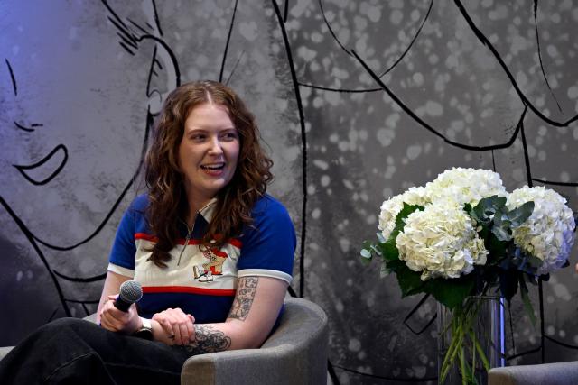 British author of Heartstopper Alice Oseman speaks during the presentation of the latest book in the Heartstopper saga at the Esperanza Iris Theater in Mexico City on July 30, 2026. The Heartstopper saga was adapted into a Netflix TV series and recently into a movie on the same platform. (Photo by Alfredo ESTRELLA / AFP)