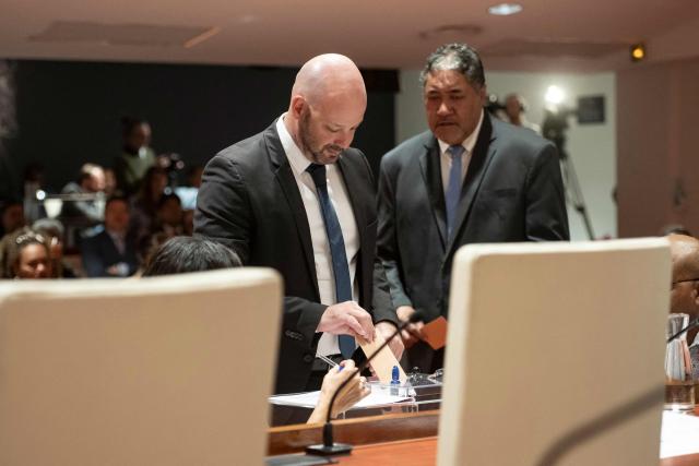 Christopher Gyges, Les Loyalistes group, casts his vote during a formal session to elect members of the Government of New Caledonia at the Congress in Noumea on July 31, 2026. (Photo by Delphine Mayeur / AFP)