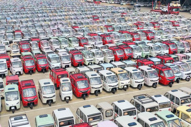 This photo shows electric tricycles being prepared for shipment in Linyi, China’s eastern Shandong province on July 30, 2026. (Photo by CN-STR / AFP) / China OUT