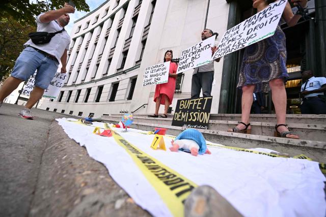 Members of French association for children rights Mouv Enfants, including its president Arnaud Gallais (L), stage a protest outside the offices of France's top rights watchdog to call for the resignation of its newly appointed head, in Paris, on July 31, 2026. Lawmakers from both houses of parliament on July 21, 2026 backed Francois-Noel Buffet, a right-winger previously opposed to same-sex marriage to lead the institution. Campaigners accuse Buffet of protesting against legalising marriage and adoption for same-sex couples in 2013, and in more recent years of having voted against allowing all women to have access to medically assisted reproduction. (Photo by Lou BENOIST / AFP)