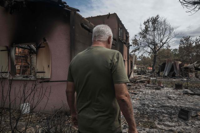 Bruno, 60, stands before his home which was destroyed by fire, in the village of Le Porge, south-western France on July 31, 2026, as a wildfire has been ravaging the forest north of the Arcachon Basin (Gironde) since July 22. (Photo by Ed JONES / AFP)