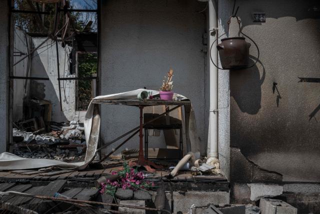 This photograph shows the entrance to a fire-damaged house in Le Porge, south-western France on July 31, 2026, as a wildfire has been ravaging the forest north of the Arcachon Basin (Gironde) since July 22. (Photo by Ed JONES / AFP)