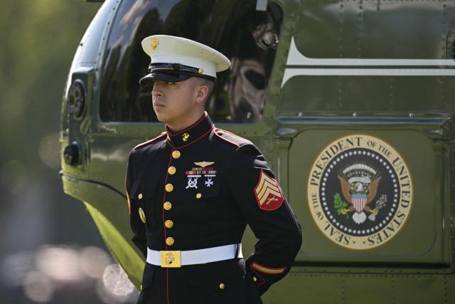 A Marine looks on before US President Donald Trump boards Marine One on the Ellipse near the White House in Washington, DC, on July 31, 2026. President Trump is traveling to Camp David in Maryland to hold a cabinet meeting and later to Bedminster, New Jersey to spend the weekend at his golf club. (Photo by Oliver Contreras / AFP)