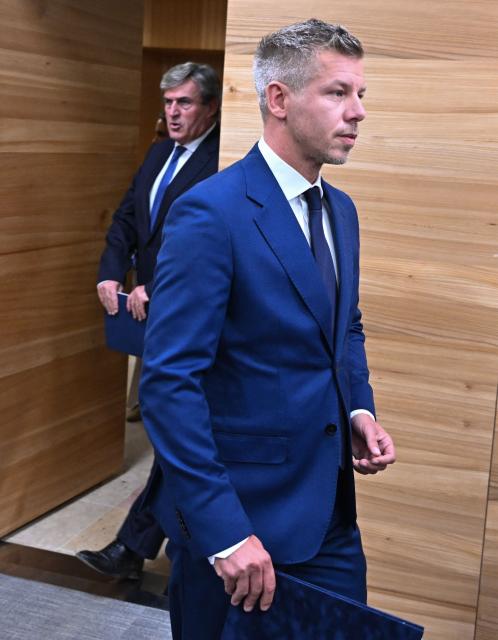 Hungary's Prime Minister Peter Magyar arrives with Hungary's Minister of Economy and Energy Istvan Kapitany (L) for a press conference at the Paks nuclear power plant in Paks on July 31, 2026. Like many European rivers, the water level of the Danube is approaching its historic low. As a result, the power plant's cooling water system is also working under more difficult conditions due the critical hot weather and, according to the Prime Minister's announcement, the power plant's output will be further reduced in the evening hours. (Photo by Attila KISBENEDEK / AFP)