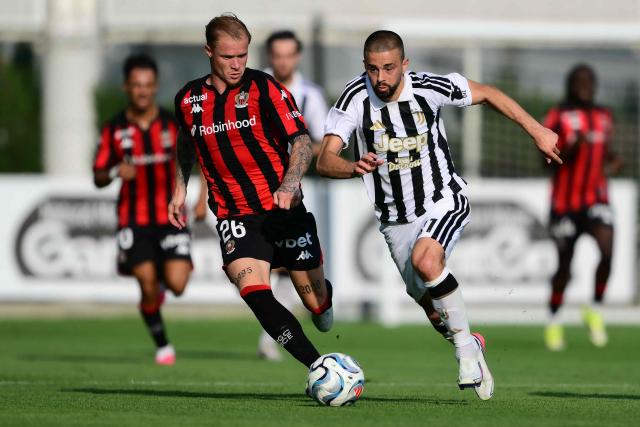 Juventus' Albanian forward #11 Edon Zhegrova fights for the ball with Nice's French defender #26 Melvin Bard during the Friendly football match between Juventus and Nice at the Juventus Training Center in Turin, on July 31, 2026. (Photo by Marco BERTORELLO / AFP)