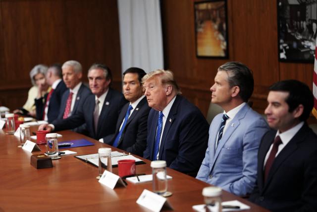 US President Donald Trump flancked by, L-R, White House Chief of Staff Susie Wiles, US Secretary for Veterans Affairs Doug Collins, Secretary of Energy Chris Wright, Secretary of the Interior Doug Burgum, Secretary of State Marco Rubio, Secretary of Defense Pete Hegseth, and Acting Labor Secretary Keith Sonderling listen during a Cabinet meeting at Camp David in Maryland, on July 31, 2026. (Photo by Aaron Schwartz / AFP)
