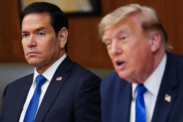 US Secretary of State Marco Rubio looks on as President Donald Trump speaks during a Cabinet meeting at Camp David in Maryland, on July 31, 2026. (Photo by Aaron Schwartz / AFP)