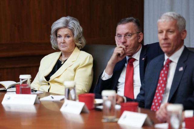 (L/R) White House Chief of Staff Susie Wiles, US Secretary for Veterans Affairs Doug Collins, and Secretary of Energy Chris Wright look on during a Cabinet meeting hosted by President Donald Trump at Camp David in Maryland, on July 31, 2026. (Photo by Aaron Schwartz / AFP)
