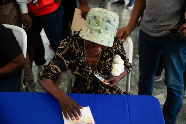 Haitians register to vote in the upcoming general election, in Port-au-Prince, Haiti, on July 31, 2026. Haiti's electoral council on July 27, 2026, set December 13 as the date for the crisis-wracked nation's first elections in a decade, pending the establishment of an "acceptable security environment." Elections have not been held in Haiti since 2016, and the country's last elected president, Jovenel Moise, was assassinated in 2021. (Photo by Clarens SIFFROY / AFP)