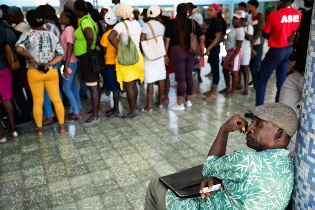 Haitians wait in line to register to vote in the upcoming general election, in Port-au-Prince, Haiti, on July 31, 2026. Haiti's electoral council on July 27, 2026, set December 13 as the date for the crisis-wracked nation's first elections in a decade, pending the establishment of an "acceptable security environment." Elections have not been held in Haiti since 2016, and the country's last elected president, Jovenel Moise, was assassinated in 2021. (Photo by Clarens SIFFROY / AFP)