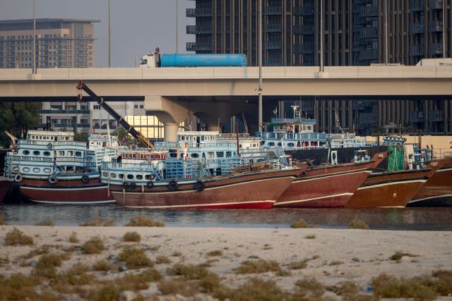 Vessels are anchored in the waters at Dubai on July 31, 2026. On February 28, Israel and the United States launched strikes on Iran killing its supreme leader and triggering a war that spread across the Middle East and unleashed chaos across global markets and sent oil prices soaring, throwing the region into chaos as Iran and the United States battle for control of the Strait of Hormuz water way. (Photo by FADEL SENNA / AFP) / 