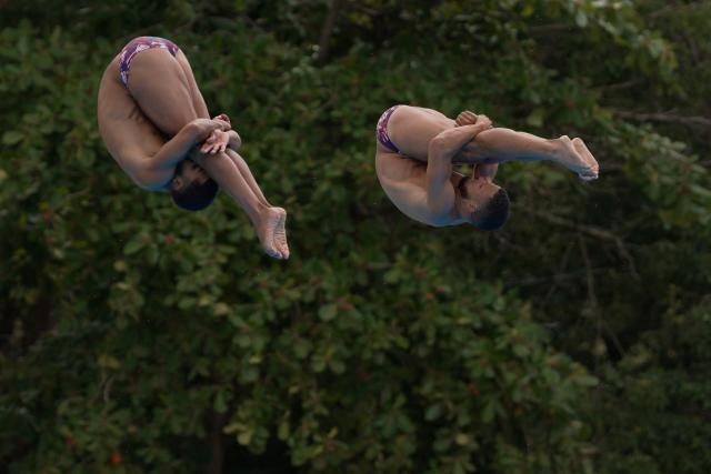 Dominican Republic’s Jose Calderon and Frandiel Gomez take part in the  Men’s 3m Synchronised Springboard final during the XXV Central American and Caribbean Games in Santo Domingo on July 31, 2026. (Photo by Francesco SPOTORNO / AFP)