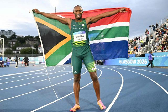 Winner South Africa's Sinesipho Dambile celebrates after competing the men's 200m final during the athletics event at the Scotstoun Stadium in Glasgow, on day eight of the Commonwealth Games in Glasgow, Scotland, on July 31, 2026. (Photo by ANDY BUCHANAN / AFP)