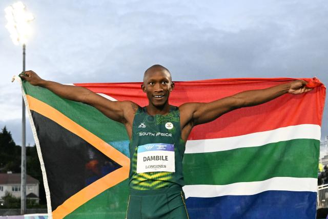 Winner South Africa's Sinesipho Dambile celebrates after competing the men's 200m final during the athletics event at the Scotstoun Stadium in Glasgow, on day eight of the Commonwealth Games in Glasgow, Scotland, on July 31, 2026. (Photo by ANDY BUCHANAN / AFP)