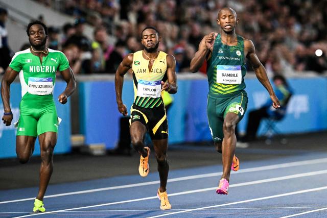 (From L) Second-placed Nigeria's Udodi Chudi Onwuzurike, third-placed Jamaica's Christopher Taylor and first-placed South Africa's Sinesipho Dambile compete in the men's 200m final during the athletics event at the Scotstoun Stadium in Glasgow, on day eight of the Commonwealth Games in Glasgow, Scotland, on July 31, 2026. (Photo by ANDY BUCHANAN / AFP)