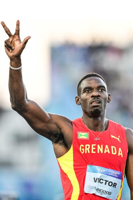Winner Grenada's Lindon Victor flashes the number three with his fingers after winning his third Commonwealth Games title after competing in the men's decathlon 1500m and following his victory in the decathlon overall competition during the athletics event at the Scotstoun Stadium in Glasgow, on day eight of the Commonwealth Games in Glasgow, Scotland, on July 31, 2026. (Photo by ANDY BUCHANAN / AFP)