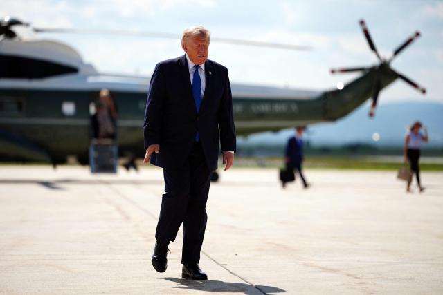 US President Donald Trump walks to board Air Force One before departing Hagerstown Regional Airport in Washington County, Maryland, on July 31, 2026, following a Cabinet meeting at Camp David. (Photo by Aaron Schwartz / AFP)