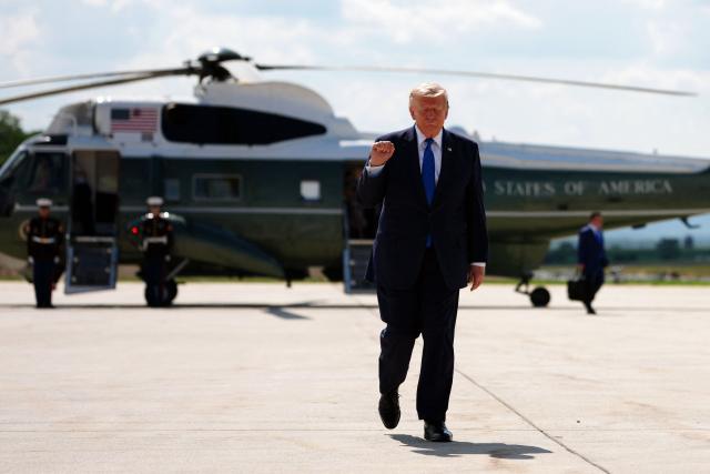 US President Donald Trump walks to board Air Force One before departing Hagerstown Regional Airport in Washington County, Maryland, on July 31, 2026, following a Cabinet meeting at Camp David. (Photo by Aaron Schwartz / AFP)
