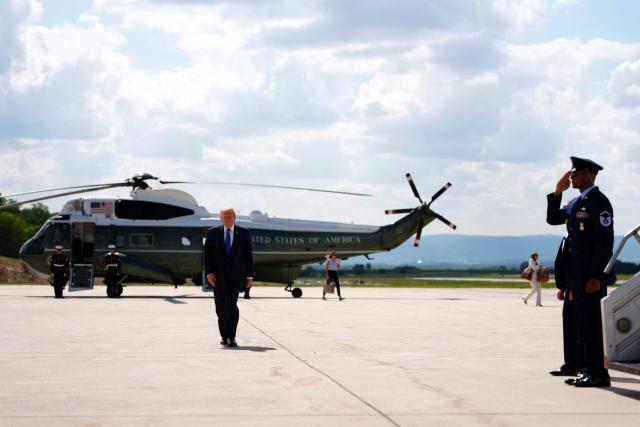 US President Donald Trump walks to board Air Force One before departing Hagerstown Regional Airport in Washington County, Maryland, on July 31, 2026, following a Cabinet meeting at Camp David. (Photo by Aaron Schwartz / AFP)