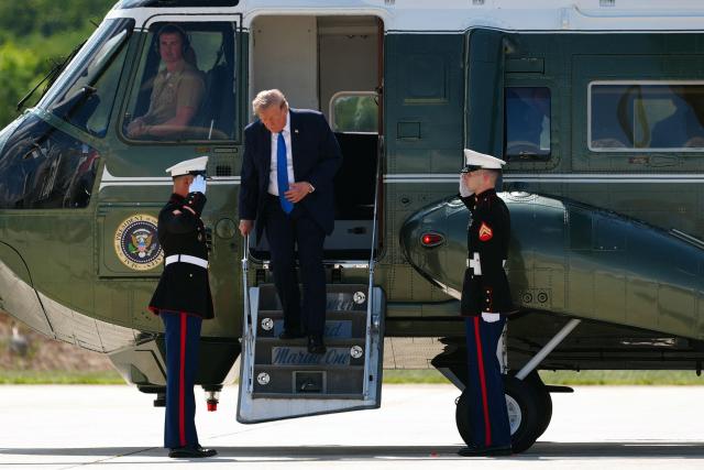 US President Donald Trump steps off Marine One before boarding Air Force One as he departs from Hagerstown Regional Airport in Washington County, Maryland, on July 31, 2026, following a cabinet meeting at Camp David. (Photo by Aaron Schwartz / AFP)