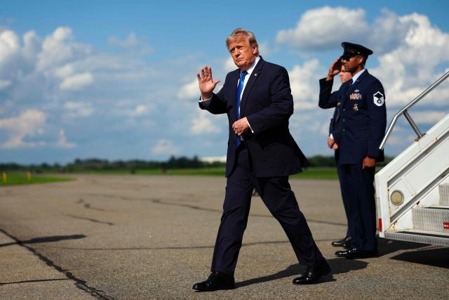 US President Donald Trump steps off Air Force One upon arrival at Morristown Municipal Airport in Morristown, New Jersey, on July 31, 2026. President Trump arrived in New Jersey to spend the weekend at his National Golf Club in Bedminster, following a cabinet meeting in Camp David, Maryland. (Photo by Aaron Schwartz / AFP)
