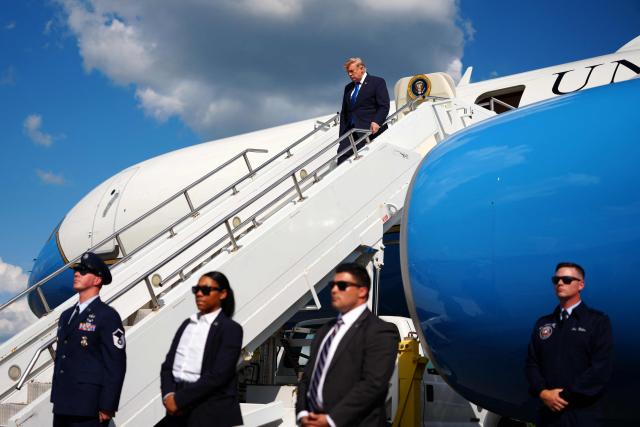 US President Donald Trump steps off Air Force One upon arrival at Morristown Municipal Airport in Morristown, New Jersey, on July 31, 2026. President Trump arrived in New Jersey to spend the weekend at his National Golf Club in Bedminster, following a cabinet meeting in Camp David, Maryland. (Photo by Aaron Schwartz / AFP)