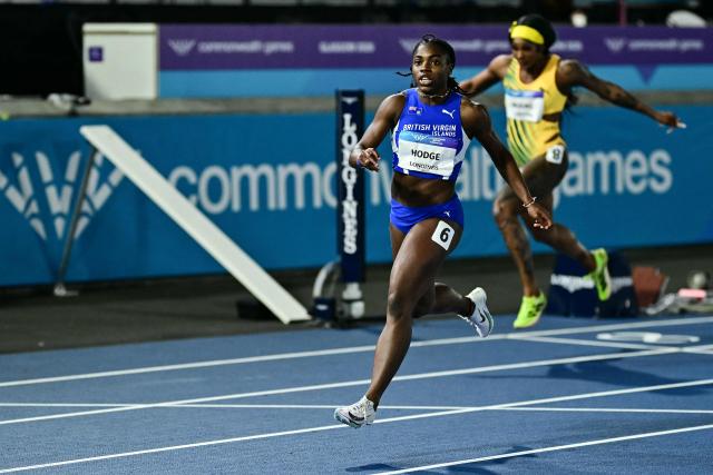 British Virgin Islands' Adaejah Hodge celebrates as she crosses the finish line to win in the women's 200m final during the athletics event at the Scotstoun Stadium in Glasgow, on day eight of the Commonwealth Games in Glasgow, Scotland, on July 31, 2026. (Photo by Ben STANSALL / AFP)