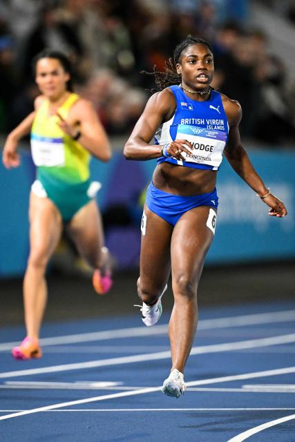 British Virgin Islands' Adaejah Hodge celebrates as she crosses the finish line to win in the women's 200m final during the athletics event at the Scotstoun Stadium in Glasgow, on day eight of the Commonwealth Games in Glasgow, Scotland, on July 31, 2026. (Photo by ANDY BUCHANAN / AFP)