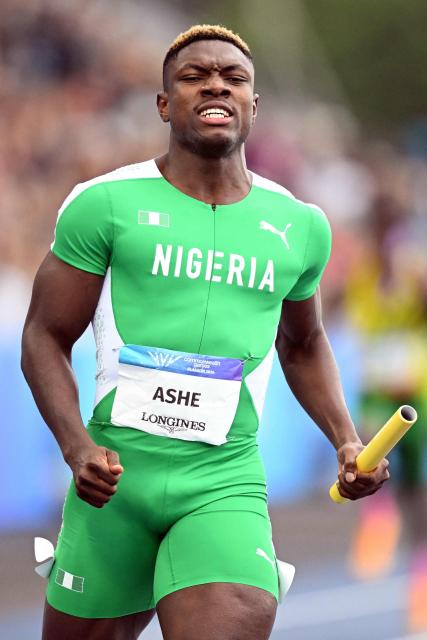 Nigeria's Favour Oghene Tejiri Ashecrosses the line to win the men's 4x100m relay heat 1 during the athletics event at the Scotstoun Stadium in Glasgow, on day nine of the Commonwealth Games in Glasgow, Scotland, on August 1, 2026. (Photo by ANDY BUCHANAN / AFP)