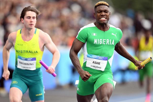 Nigeria's Favour Oghene Tejiri Ashecrosses the line to win the men's 4x100m relay heat 1 during the athletics event at the Scotstoun Stadium in Glasgow, on day nine of the Commonwealth Games in Glasgow, Scotland, on August 1, 2026. (Photo by ANDY BUCHANAN / AFP)