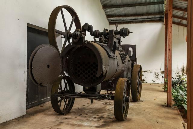 General view of old steam engine used on the Roça Sundy, near Santo Antonio, in Príncipe Island in São Tomé and Príncipe, on  August 1, 2026. Located on Príncipe island, Roça Sundy is famous both for its cocoa production and the historical site where Arthur Eddington conducted observations proving Einstein's theory of general relativity. It is one of six roças recognized as UNESCO World Heritage sites. The Roças are historic agricultural plantations in São Tomé and Príncipe that were established by the Portuguese in the 19th and 20th centuries for coffee and cocoa production. Operating as self-sufficient, hierarchical complexes, they included processing factories, housing (sanzalas), hospitals, and railways. (Photo by Daniel BELOUMOU OLOMO / AFP)