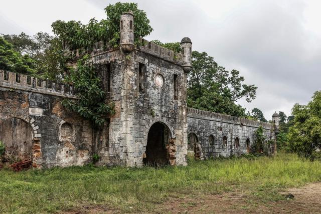 General view of the horse paddocks at Roça Sundy, near Santo Antonio, in Príncipe Island in São Tomé and Príncipe, on  August 1, 2026. Located on Príncipe island, Roça Sundy is famous both for its cocoa production and the historical site where Arthur Eddington conducted observations proving Einstein's theory of general relativity. It is one of six roças recognized as UNESCO World Heritage sites. The Roças are historic agricultural plantations in São Tomé and Príncipe that were established by the Portuguese in the 19th and 20th centuries for coffee and cocoa production. Operating as self-sufficient, hierarchical complexes, they included processing factories, housing (sanzalas), hospitals, and railways. (Photo by Daniel BELOUMOU OLOMO / AFP)