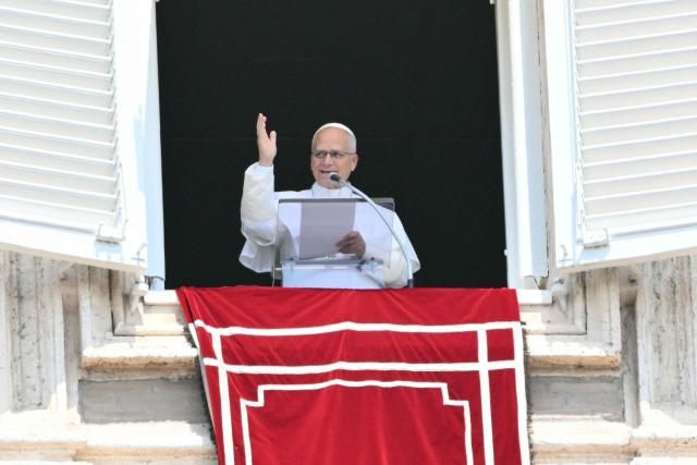 Pope Leo XIV addresses the crowd from the window of the apostolic palace overlooking St. Peter's square during the Angelus prayer in The Vatican on August 2, 2026. (Photo by Alberto PIZZOLI / AFP)