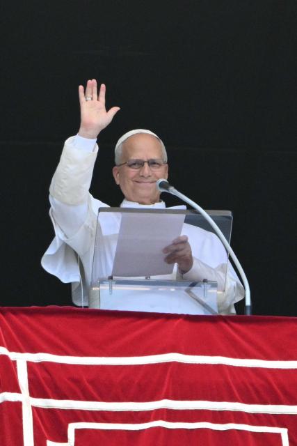 Pope Leo XIV waves to the crowd from the window of the apostolic palace overlooking St. Peter's square during the Angelus prayer in The Vatican on August 2, 2026. (Photo by Alberto PIZZOLI / AFP)