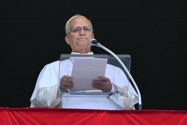 Pope Leo XIV addresses the crowd from the window of the apostolic palace overlooking St. Peter's square during the Angelus prayer in The Vatican on August 2, 2026. (Photo by Alberto PIZZOLI / AFP)