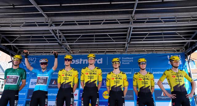 Belgium's Wout van Aert (2L) of Team Visma - Lease a Bike in the blue PostNord leader's jersey poses with team members before Stage 5 of the PostNord Denmark Tour, the 126 km-long stage from Koege to Roedovre on August 2, 2026. (Photo by Claus Bech / Ritzau Scanpix / AFP) / Denmark OUT
