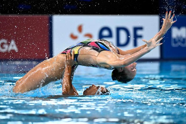 Bulgaria's artistic swimmers Dimitar Isaev and Magdalena Maleva compete in the mixed duet technical swimming final event during the LEN European Aquatics Championships, at the Olympic Aquatics Centre in Saint-Denis, northeastern suburbs of Paris, on August 2, 2026.  (Photo by JULIEN DE ROSA / AFP)