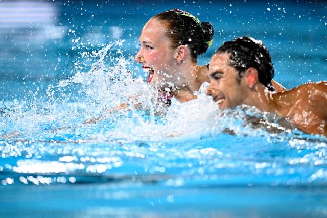 Bulgaria's artistic swimmers Dimitar Isaev (hidden) and Magdalena Maleva compete in the mixed duet technical swimming final event during the LEN European Aquatics Championships, at the Olympic Aquatics Centre in Saint-Denis, northeastern suburbs of Paris, on August 2, 2026.  (Photo by JULIEN DE ROSA / AFP)