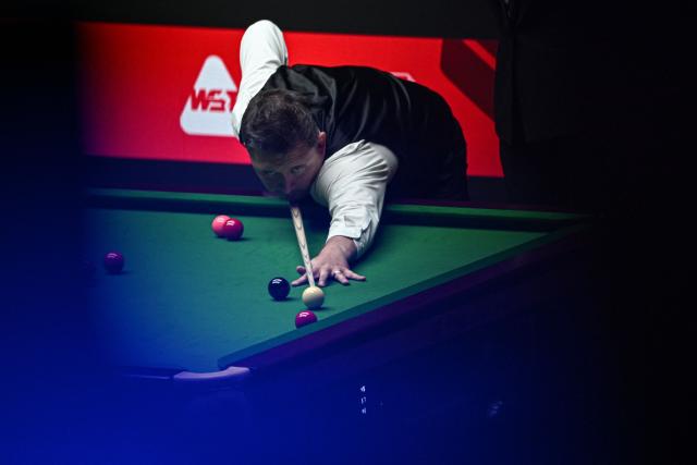 England's Kyren Wilson plays a shot during his match against England's Judd Trump at the Shanghai Masters snooker tournament in Shanghai on August 2, 2026. (Photo by Jade GAO / AFP)